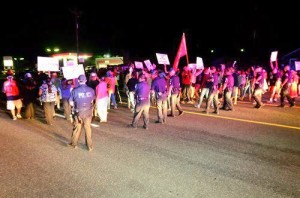 Protesters succeed in temporarily stalling the megaload for a few minutes at Canoe Camp, as police attempt to disperse the crowd and allow the oversized rig to pass on U.S. Highway 12 (Lewiston Tribune/Steve Hanks photo).