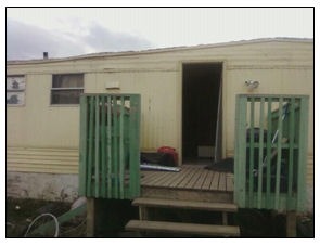 Home of Heather Youngbird and Crystal Deegan after the door was removed Monday afternoon at Prairie Winds Mobile Home Park in New Town.