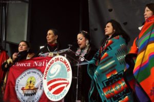 Tribal members onstage at anti–Keystone XL and climate change rally on February 17, 2013, left to right: Patricia Shepard (Ojibwe, Wisconsin), Casey Camp (Ponca, Oklahoma), Crystal Lameman (Beaver Lake Cree, Alberta, Canada), Melina Laboucan-Massimo (Lubicon Cree, Northern Alberta, Canada) and Kandi Mossett (Mandan, Hidatsa, Arikara Photo Credit: Jenna Pope