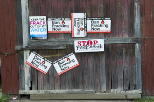 Signs protest fracking on the side of a barn in Pennsylvania.Credit: Melanie Blanding