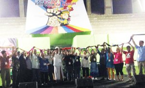 Grassroots leaders from social movements across Asia tie their scarves together at the declaration of the SMAA hemispheric alliance.