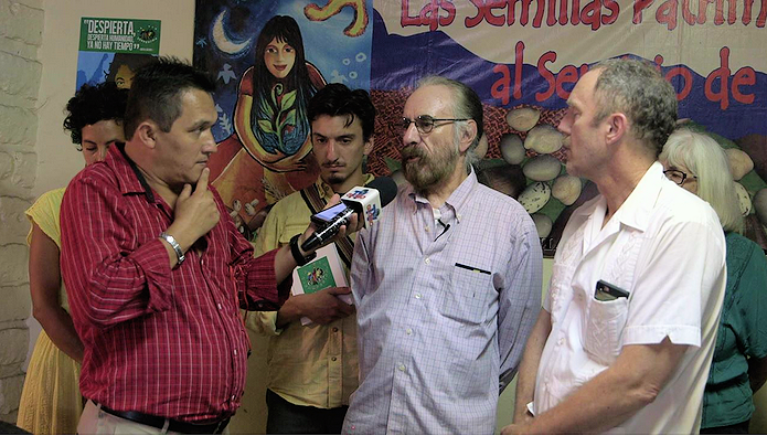 Alberto Saldamando speaking with press at La Via Campasina Office